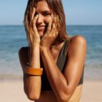 Happy woman bikini model on beach